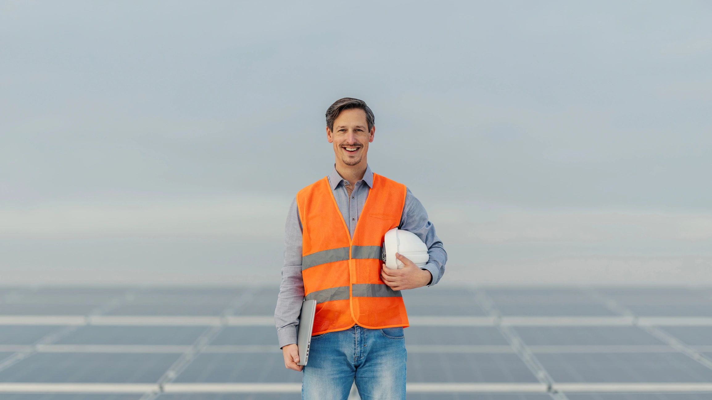 Renewable energy engineer at a solar panel farm